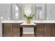 Double vanity bathroom with modern dark brown cabinets at 19583 W Cheery Lynn Rd, Buckeye, AZ 85396