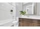 Bathroom with a bathtub, toilet and modern vanity at 19583 W Cheery Lynn Rd, Buckeye, AZ 85396