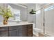 Bathroom with vanity, toilet, and glass-enclosed shower at 19583 W Cheery Lynn Rd, Buckeye, AZ 85396