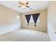 Large bedroom with carpeted floors, ceiling fan, and ample natural light at 19583 W Cheery Lynn Rd, Buckeye, AZ 85396