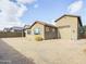 Single story home with attached garage and desert landscaping at 19583 W Cheery Lynn Rd, Buckeye, AZ 85396