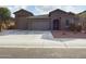 Two-story house with a gray exterior, two-car garage, and a well-maintained front yard at 19583 W Cheery Lynn Rd, Buckeye, AZ 85396