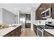 Modern kitchen with stainless steel appliances and white countertops at 19583 W Cheery Lynn Rd, Buckeye, AZ 85396