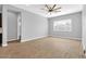 Spacious living room with ceiling fan and neutral color palette at 19583 W Cheery Lynn Rd, Buckeye, AZ 85396