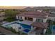 Luxury home with a large pool and expansive backyard at 19780 E Ivy Ln, Queen Creek, AZ 85142