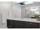 Modern bathroom with double vanity and large mirror at 19780 E Ivy Ln, Queen Creek, AZ 85142