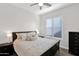 Main bedroom with dark wood frame bed and window shutters at 19780 E Ivy Ln, Queen Creek, AZ 85142