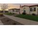 Two-story home with landscaping and walkway at 19780 E Ivy Ln, Queen Creek, AZ 85142