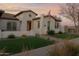 Elegant home with manicured lawn and walkway at 19780 E Ivy Ln, Queen Creek, AZ 85142