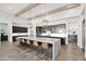 Large kitchen island with seating for six and a stylish pendant lighting at 19780 E Ivy Ln, Queen Creek, AZ 85142