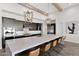 Modern kitchen with expansive island and stylish light fixtures at 19780 E Ivy Ln, Queen Creek, AZ 85142