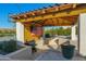 Outdoor kitchen with built-in grill and bar area at 19780 E Ivy Ln, Queen Creek, AZ 85142