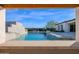 Stunning pool view from under a covered patio at 19780 E Ivy Ln, Queen Creek, AZ 85142