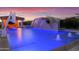 Large pool with a waterslide and a waterfall feature at 19780 E Ivy Ln, Queen Creek, AZ 85142