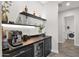 Modern wet bar with beverage fridge, coffee maker, and under-counter lighting at 19780 E Ivy Ln, Queen Creek, AZ 85142