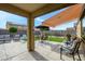 Cozy backyard patio with seating area and retractable awning at 20017 W Jackson St, Buckeye, AZ 85326