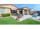 Relaxing backyard patio with seating and a dining table at 20017 W Jackson St, Buckeye, AZ 85326