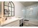 Elegant bathroom with white vanity, soaking tub, and frameless glass shower at 20017 W Jackson St, Buckeye, AZ 85326