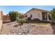 Landscaped backyard with gravel and grass at 2018 E Glenhaven Dr, Phoenix, AZ 85048