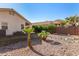 Small backyard with rock and grass at 2018 E Glenhaven Dr, Phoenix, AZ 85048