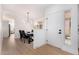 Dining area with a modern chandelier, dark wood table, and gray chairs at 2018 E Glenhaven Dr, Phoenix, AZ 85048