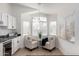 Kitchen nook with two comfy chairs and a large window at 2018 E Glenhaven Dr, Phoenix, AZ 85048