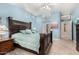 King-size bed in spacious bedroom with light walls at 20426 N 133Rd Dr, Sun City West, AZ 85375