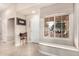 Bright entryway with a granite-topped window seat at 20426 N 133Rd Dr, Sun City West, AZ 85375