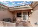 Covered patio with seating area near the front entrance at 20426 N 133Rd Dr, Sun City West, AZ 85375