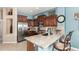 Kitchen boasts stainless steel appliances and granite counters at 20426 N 133Rd Dr, Sun City West, AZ 85375