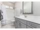 Bright bathroom with gray vanity, white countertop, and shower-tub combination at 22901 E Quintero Rd, Queen Creek, AZ 85142