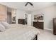 Bedroom featuring a large wooden bed frame, bedside tables, access to ensuite bathroom, and tile flooring at 22901 E Quintero Rd, Queen Creek, AZ 85142