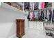 Well-organized closet with custom shelving, drawers, and a seating area at 22901 E Quintero Rd, Queen Creek, AZ 85142