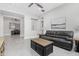 Inviting living room with comfortable seating, tile flooring, and natural light at 22901 E Quintero Rd, Queen Creek, AZ 85142