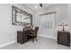 Home office with desk, ornate mirror, and window with blinds at 22901 E Quintero Rd, Queen Creek, AZ 85142