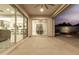 Covered patio featuring sliding glass doors leading into the home's kitchen and dining areas at 22901 E Quintero Rd, Queen Creek, AZ 85142