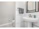 Clean and modern powder room featuring white subway tile and a pedestal sink at 22901 E Quintero Rd, Queen Creek, AZ 85142