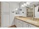 Double vanity bathroom with granite countertop and a large walk-in shower at 2344 N Raven --, Mesa, AZ 85207