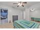 Bedroom with a bed, dresser, and view into basement media room at 2344 N Raven --, Mesa, AZ 85207