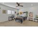 Bright bedroom with a bed, desk, and built-in shelving at 2344 N Raven --, Mesa, AZ 85207