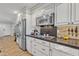 Kitchen with stainless steel appliances and dark countertops at 2344 N Raven --, Mesa, AZ 85207