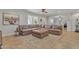 Living room with brown leather sectional and ottoman at 2344 N Raven --, Mesa, AZ 85207