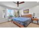 Spacious main bedroom with a large bed, ample natural light, and plenty of plants at 2344 N Raven --, Mesa, AZ 85207