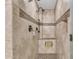 Large walk-in shower with tiled walls and built-in seat at 2344 N Raven --, Mesa, AZ 85207