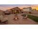 Relaxing backyard oasis with a fire pit and hot tub at 23699 N Oasis Blvd, Florence, AZ 85132