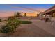 Landscaped backyard featuring a fire pit, hot tub, and patio area at 23699 N Oasis Blvd, Florence, AZ 85132