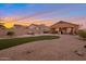 Spacious backyard with covered patio, hot tub, fire pit, and artificial turf at 23699 N Oasis Blvd, Florence, AZ 85132