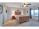 Bright bedroom featuring a wooden bed frame and ample natural light at 23699 N Oasis Blvd, Florence, AZ 85132