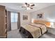 Cozy bedroom with a ceiling fan and built-in shelving at 23699 N Oasis Blvd, Florence, AZ 85132