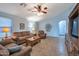 Living room with vaulted ceilings, tile floors, and comfortable furniture at 23699 N Oasis Blvd, Florence, AZ 85132